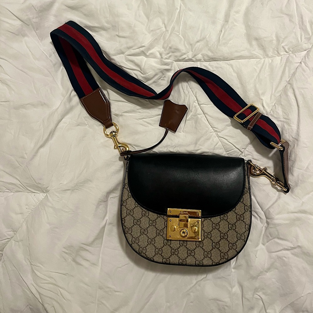 Gucci logo striped strap crossbody bag with gold closure
